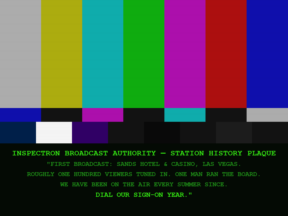 Color-bar test card. A station history plaque is burned into the lower third of the tube.